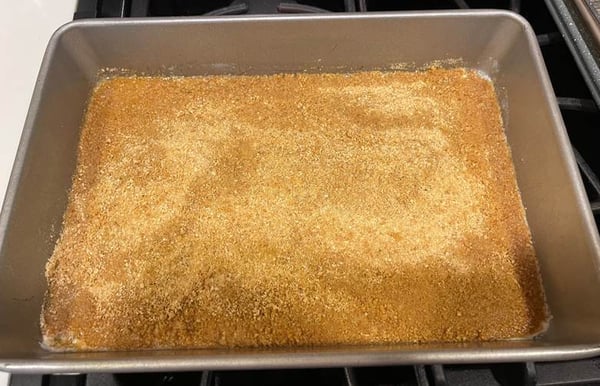 Graham cracker crumbs in pan