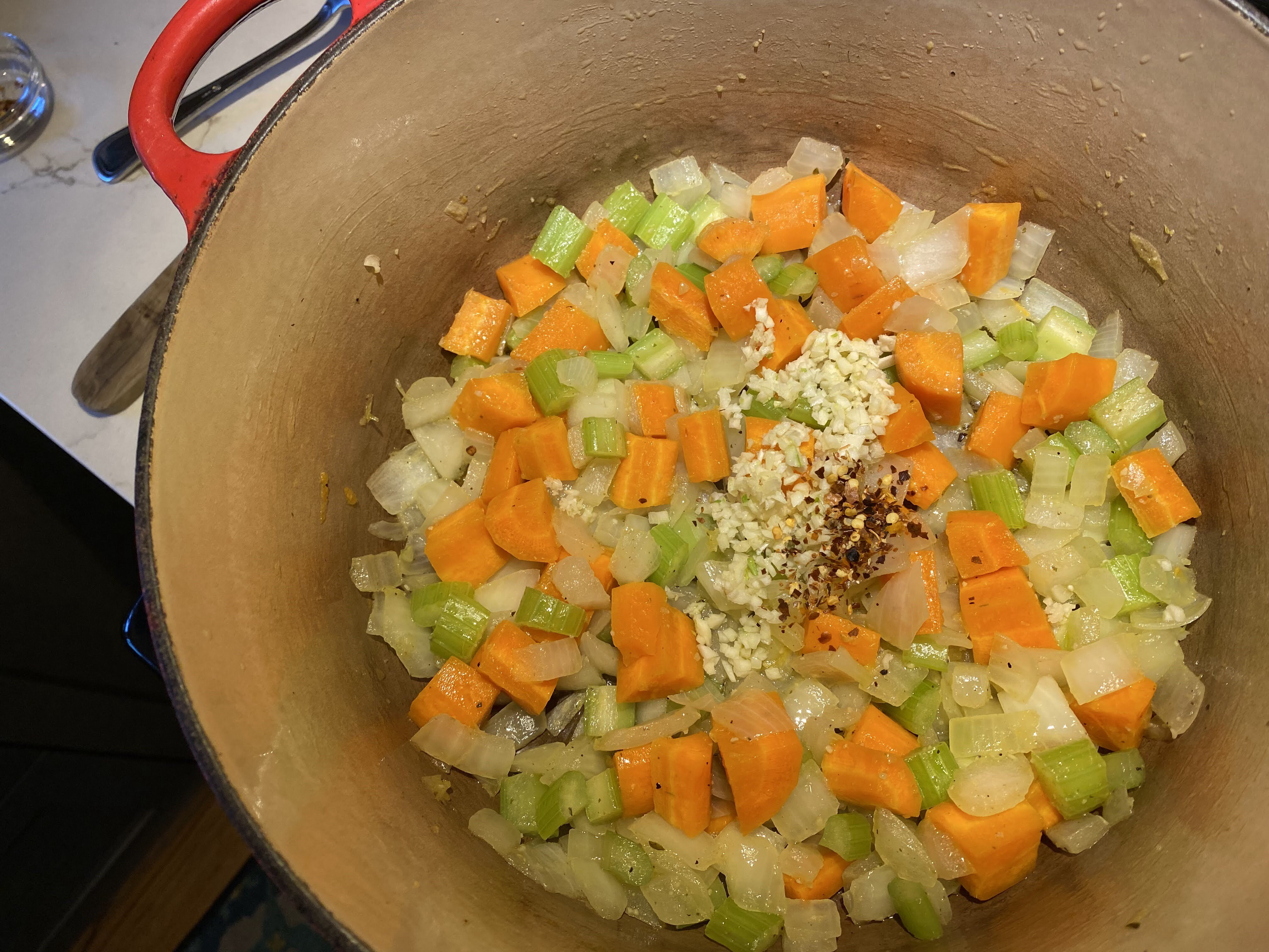 Mire poix with garlic and chili flakes