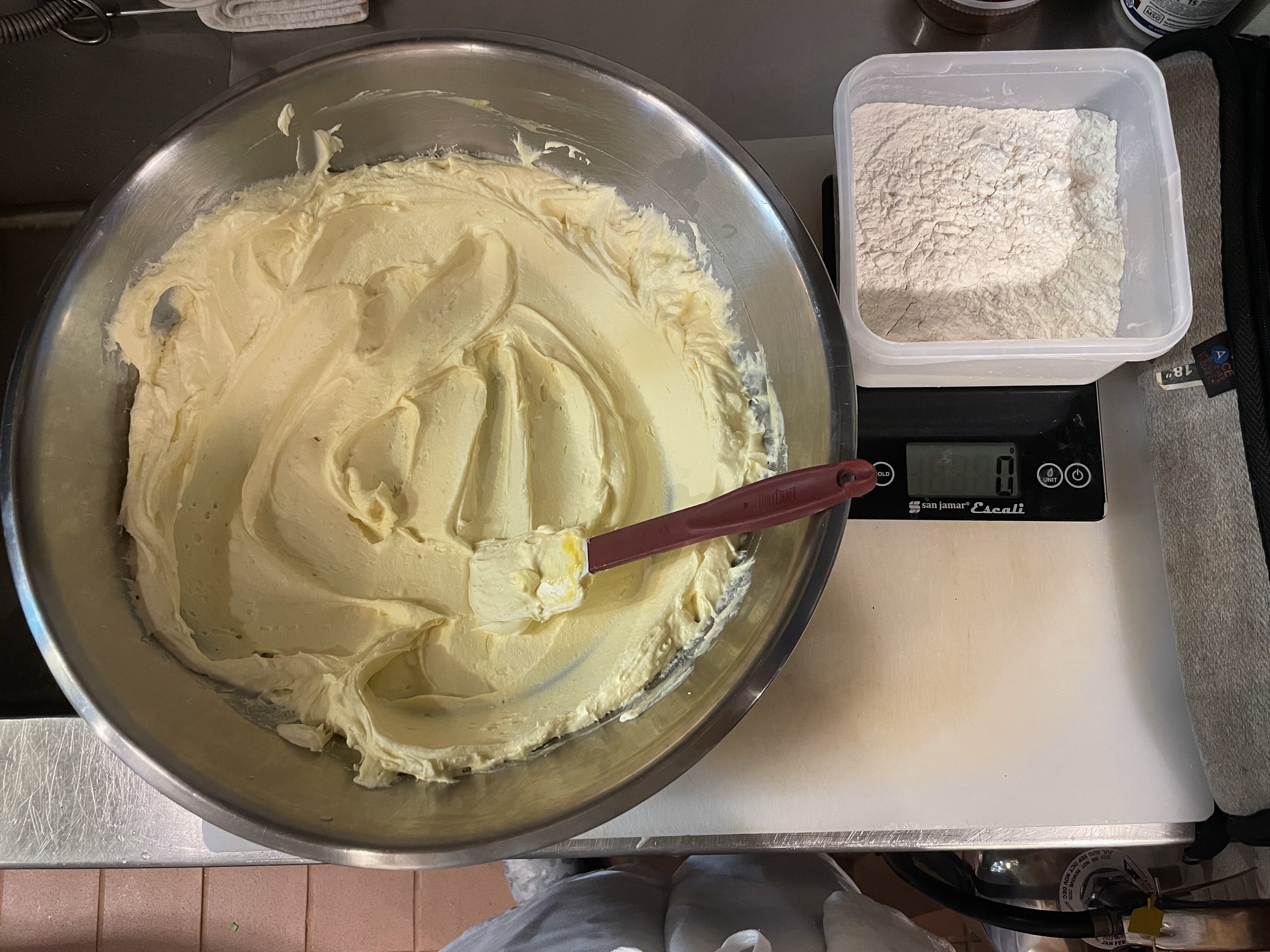 Wet ingredients mixed and weighing flour