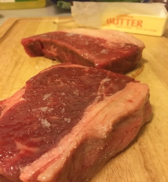 raw steak with butter