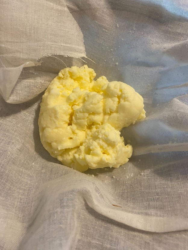 Squeezing butter in cheesecloth