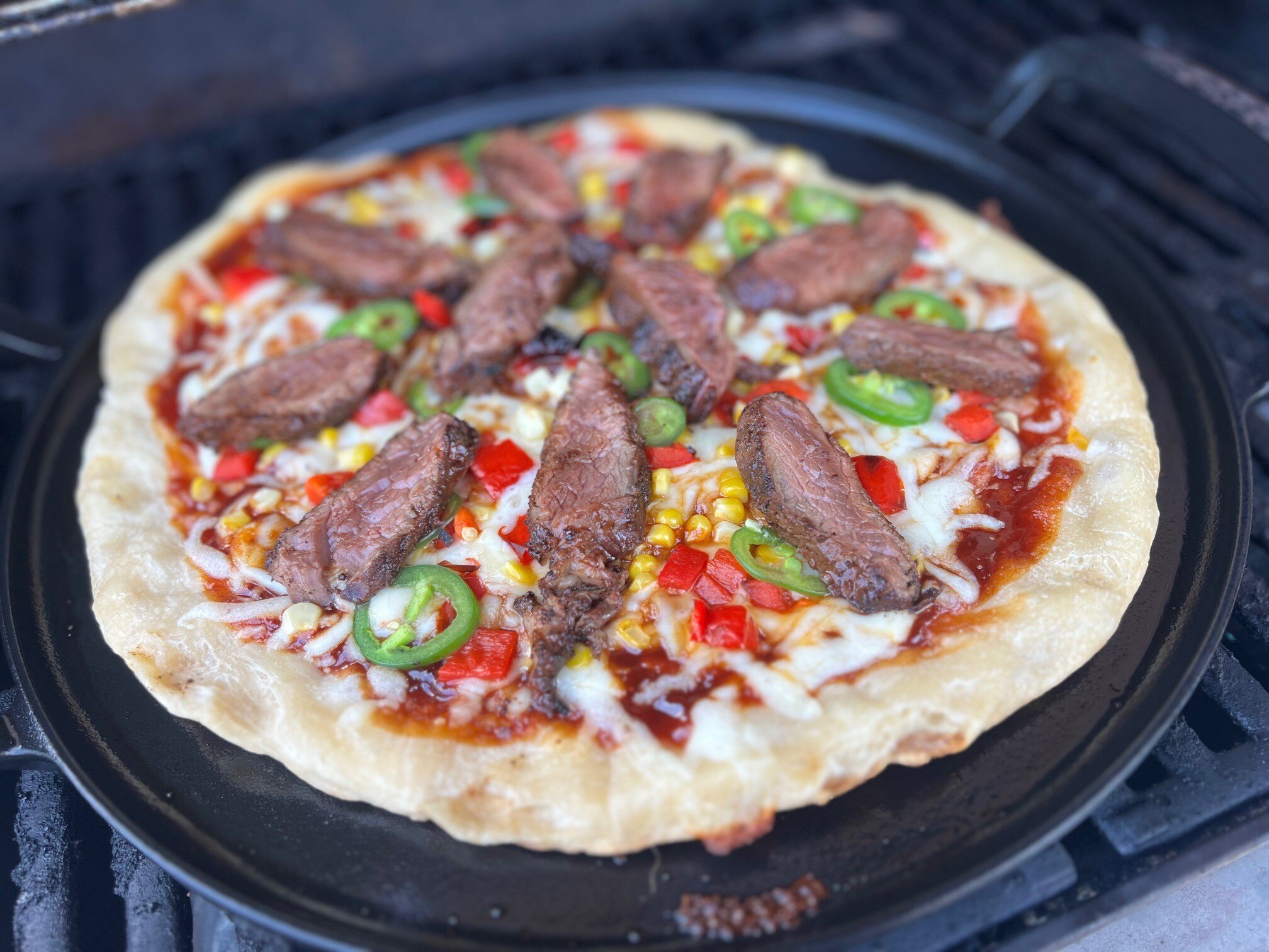 Steak on pizza